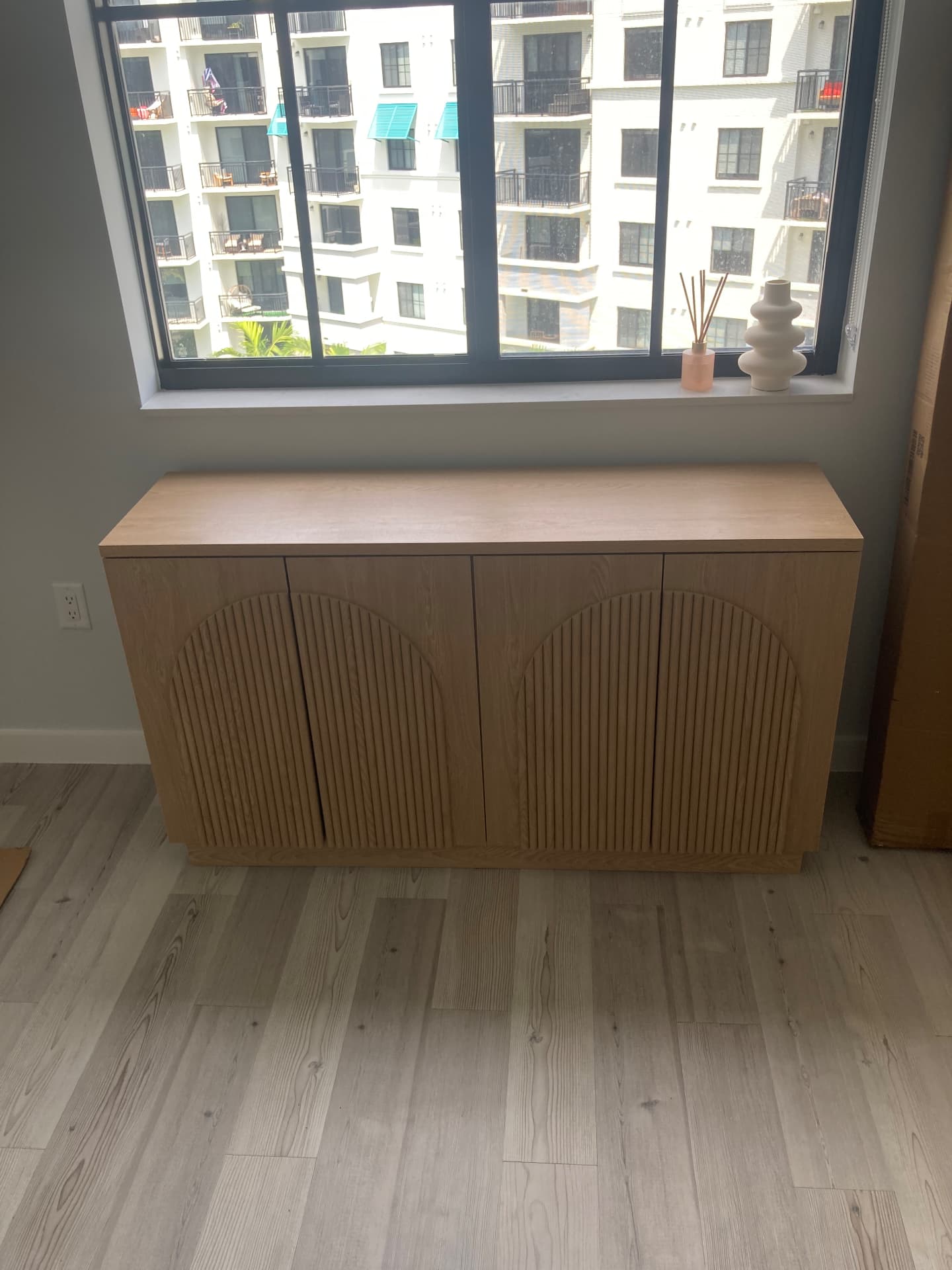 White oak arched fluted sideboard cabinet assembled in a Palm Beach Gardens condo