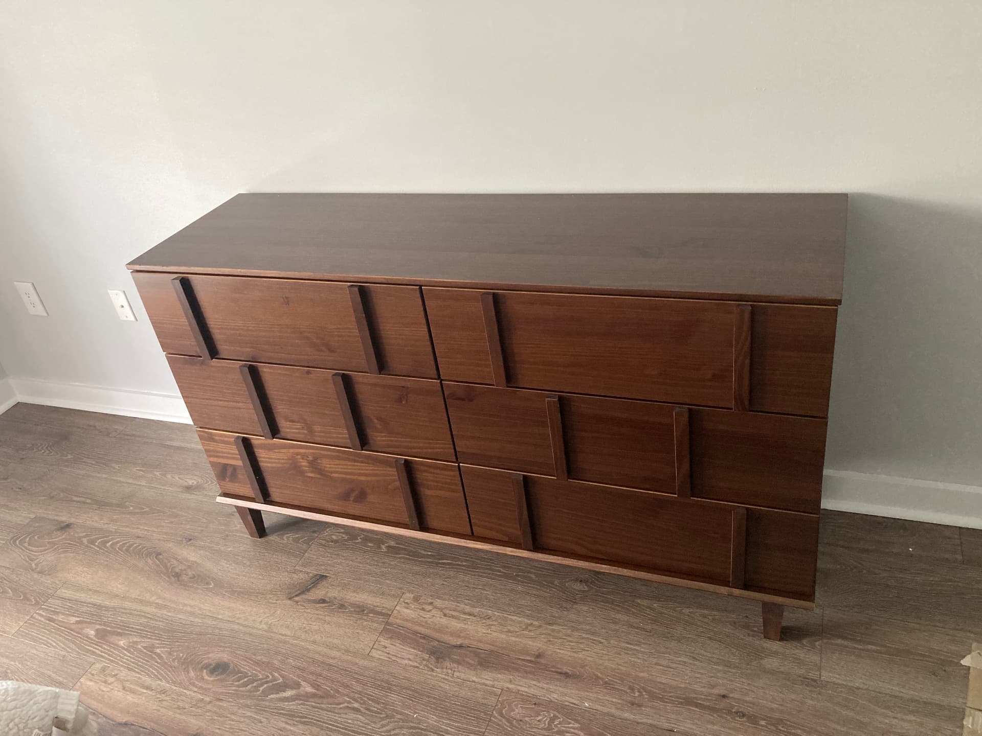 Walnut six-drawer mid century dresser assembled in a Boca Raton bedroom